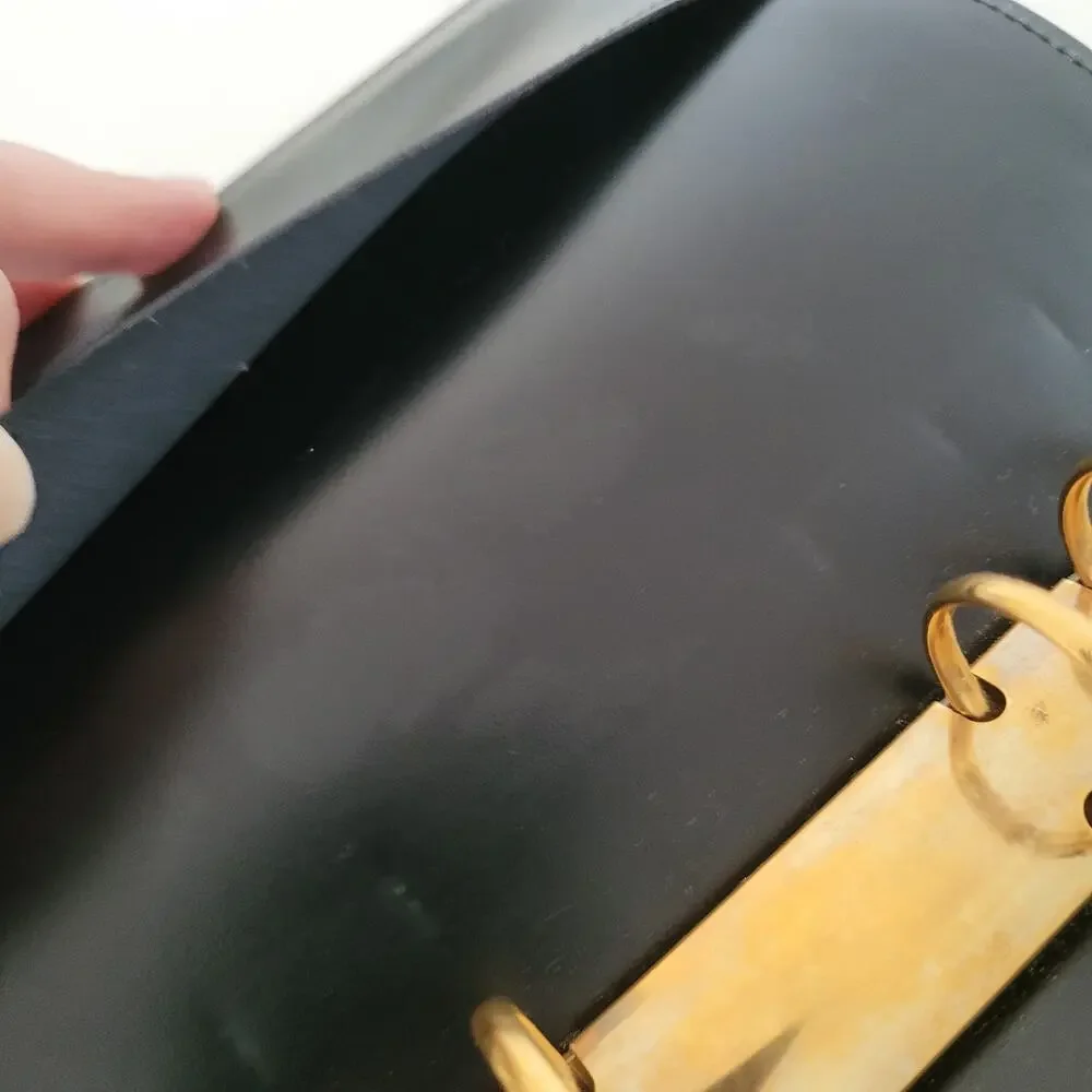 Cartier Black Leather Planner with Gold Panther Accent